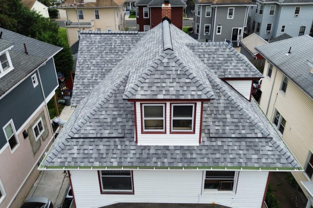 Completed residential asphalt shingle roofing project on a multi story home in New Jersey by Vesta Remodeling