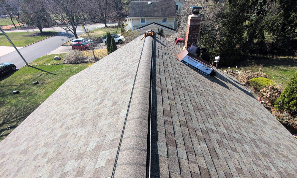 Residential asphalt shingle roof ridge vent installation in New Jersey by Vesta Remodeling