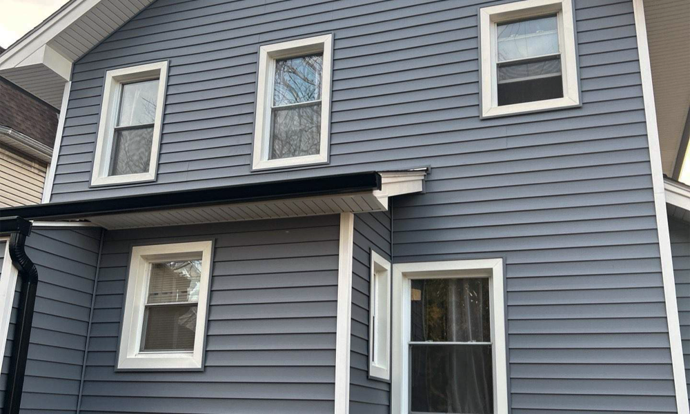 New exterior siding and window installation on residential home in New Jersey by Vesta Remodeling