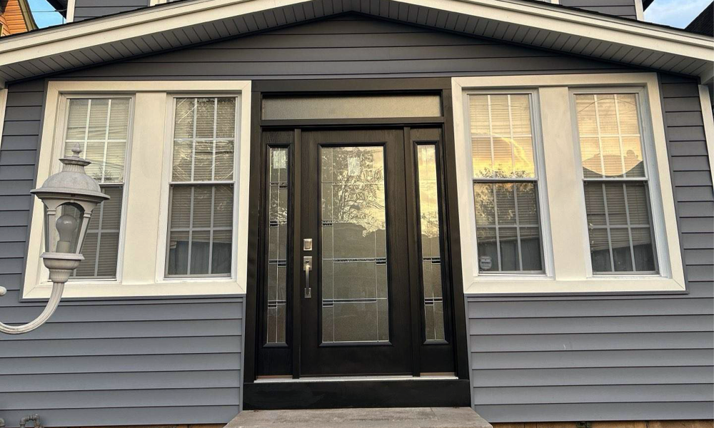 New front entry door and window installation during exterior home remodeling in New Jersey by Vesta Remodeling
